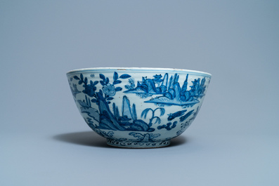 A large Chinese blue and white 'river landscape' bowl, Ming