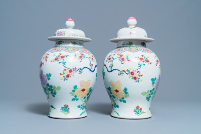 A pair of Chinese famille rose 'pheasants' vases and covers, 19th C.