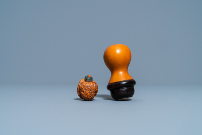 Six Chinese carved fruit pits, a walnut snuff bottle and a gourd cricket box, 19/20th C.
