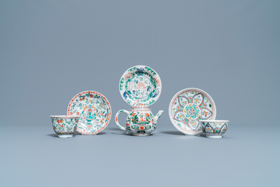 A Chinese famille verte teapot, two cups and three saucers, Kangxi