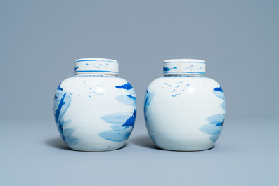 A pair of Chinese blue and white covered jars and a pair of famille rose vases, 19th C.