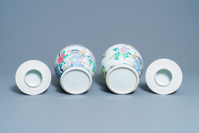 A pair of Chinese famille rose 'pheasants' vases and covers, 19th C.