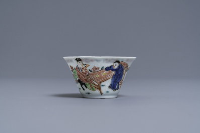 A Chinese famille rose 'tea scene' cup and saucer, Yongzheng/Qianlong