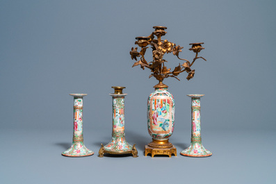 Three Chinese Canton famille rose candlesticks and a vase with gilt bronze mounts, 19th C.