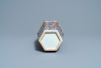 A Chinese hexagonal blue, white and copper-red brown-ground vase, 19th C.
