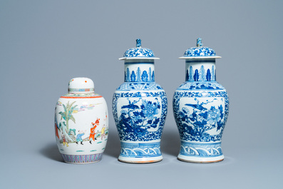 A pair of Chinese blue and white vases and a famille rose jar and cover, 19/20th C.
