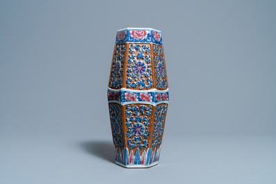 A Chinese hexagonal blue, white and copper-red brown-ground vase, 19th C.