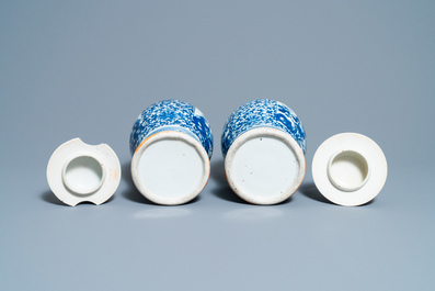 A pair of Chinese blue and white vases and a famille rose jar and cover, 19/20th C.