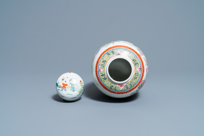 A pair of Chinese blue and white vases and a famille rose jar and cover, 19/20th C.