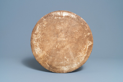 A large Chinese round blue and white plaque with floral design, 19th C.