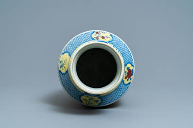 A Chinese blue, white and red yellow-ground vase, 18/19th C.