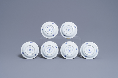 Six Chinese blue, white and copper-red cups and saucers, Kangxi