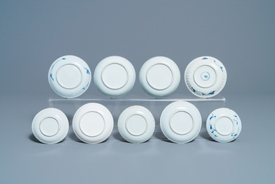 Eighteen Chinese blue and white saucers, seven cups, two dishes and a tea caddy, Kangxi/Qianlong