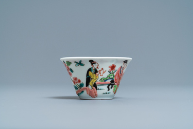 A Chinese famille rose 'tea scene' cup and saucer, Yongzheng/Qianlong