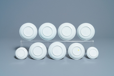 Eighteen Chinese blue and white saucers, seven cups, two dishes and a tea caddy, Kangxi/Qianlong
