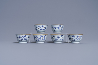 Six Chinese blue, white and copper-red cups and saucers, Kangxi