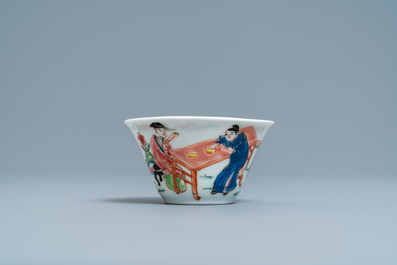A Chinese famille rose 'tea scene' cup and saucer, Yongzheng/Qianlong