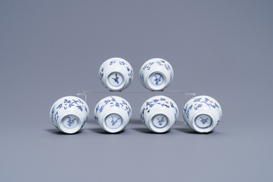 Six Chinese blue, white and copper-red cups and saucers, Kangxi