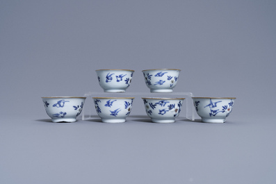 Six Chinese blue, white and copper-red cups and saucers, Kangxi