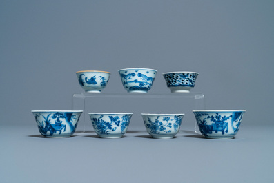Eighteen Chinese blue and white saucers, seven cups, two dishes and a tea caddy, Kangxi/Qianlong