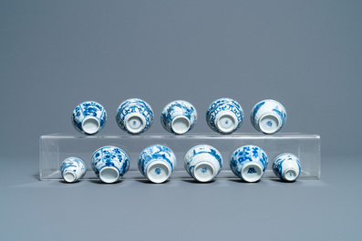 Nineteen Chinese blue and white cups and twenty-one saucers, Kangxi and later