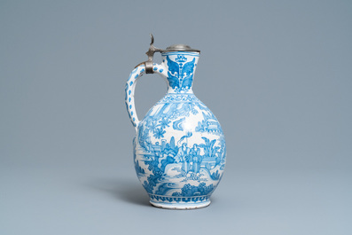 A large Dutch Delft blue and white chinoiserie jug with pewter cover, 17th C.