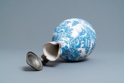 A large Dutch Delft blue and white chinoiserie jug with pewter cover, 17th C.