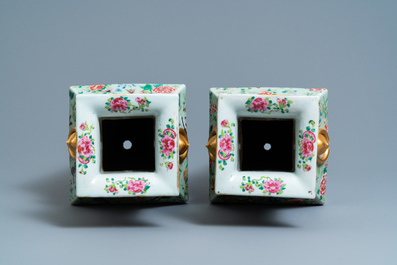 A pair of Chinese square famille rose celadon-ground vases on gilt bronze feet, 19th C.