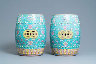 A pair of Chinese turquoise-ground famille rose garden seats, 19th C.