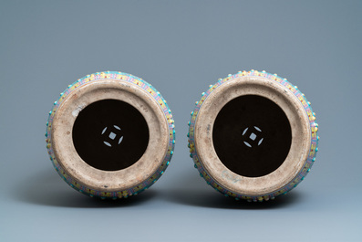 A pair of Chinese turquoise-ground famille rose garden seats, 19th C.