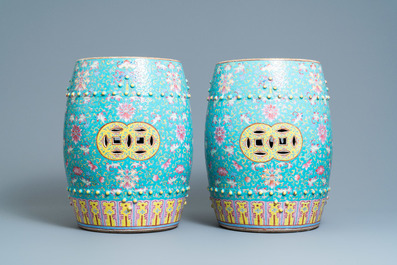 A pair of Chinese turquoise-ground famille rose garden seats, 19th C.