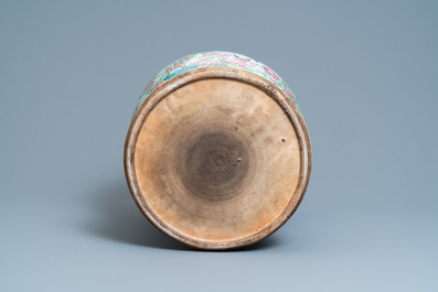 A pair of large Chinese Canton famille rose celadon-ground vases and covers, 19th C.