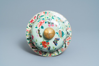 A pair of large Chinese Canton famille rose celadon-ground vases and covers, 19th C.