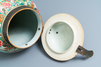 A pair of large Chinese Canton famille rose celadon-ground vases and covers, 19th C.