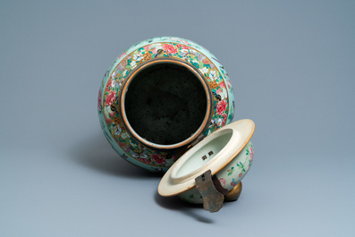 A pair of large Chinese Canton famille rose celadon-ground vases and covers, 19th C.