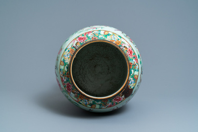 A pair of large Chinese Canton famille rose celadon-ground vases and covers, 19th C.