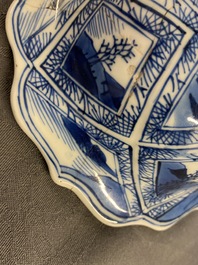 A large Chinese blue and white five-piece garniture with floral and landscape panels, Kangxi