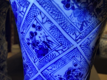 A large Chinese blue and white five-piece garniture with floral and landscape panels, Kangxi