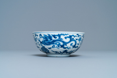 A Chinese blue and white 'dragon' bowl with a double vajra in the centre, Chenghua mark, Kangxi