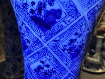 A large Chinese blue and white five-piece garniture with floral and landscape panels, Kangxi
