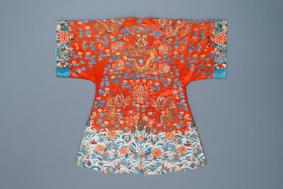 A Chinese embroidered silk red-ground 'dragon' robe, 19th C.