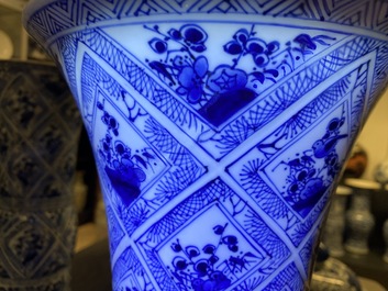 A large Chinese blue and white five-piece garniture with floral and landscape panels, Kangxi
