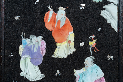 A pair of Chinese famille rose black gravel-ground plaques, Jiaqing