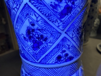 A large Chinese blue and white five-piece garniture with floral and landscape panels, Kangxi