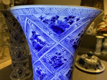 A large Chinese blue and white five-piece garniture with floral and landscape panels, Kangxi