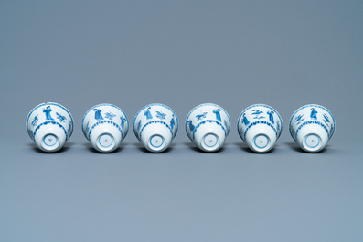 Six large Chinese blue and white cups and five saucers, Yu mark, Kangxi
