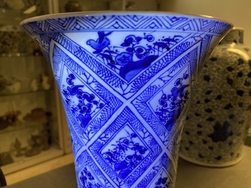 A large Chinese blue and white five-piece garniture with floral and landscape panels, Kangxi