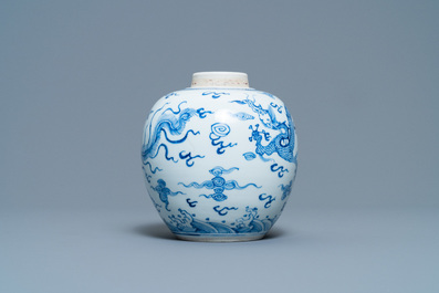 A Chinese blue and white 'dragon and phoenix' jar with wooden lid, Chenghua mark, Kangxi