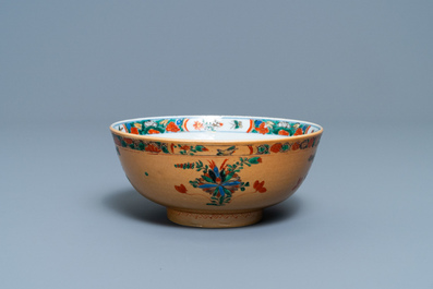 A Chinese capucine brown-ground famille verte plate and a bowl, Kangxi