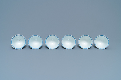 Six large Chinese blue and white cups and five saucers, Yu mark, Kangxi